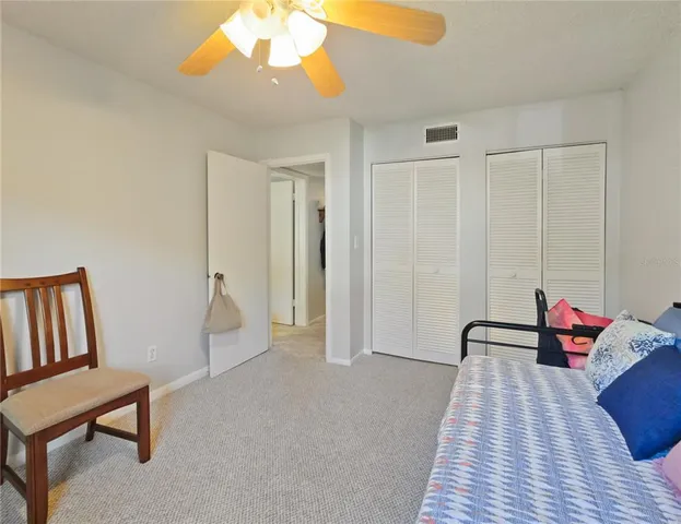 a view of a room with furniture and wooden floor
