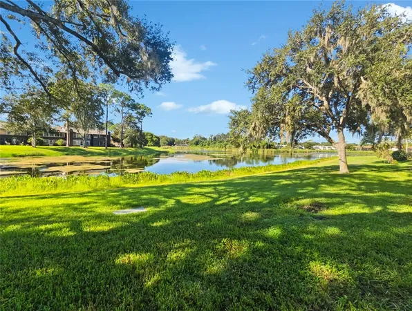 a view of a swimming pool with an outdoor space and seating area