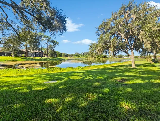 a view of a swimming pool with an outdoor space and seating area