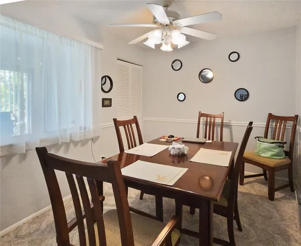 a view of a dining room that has a table and chairs