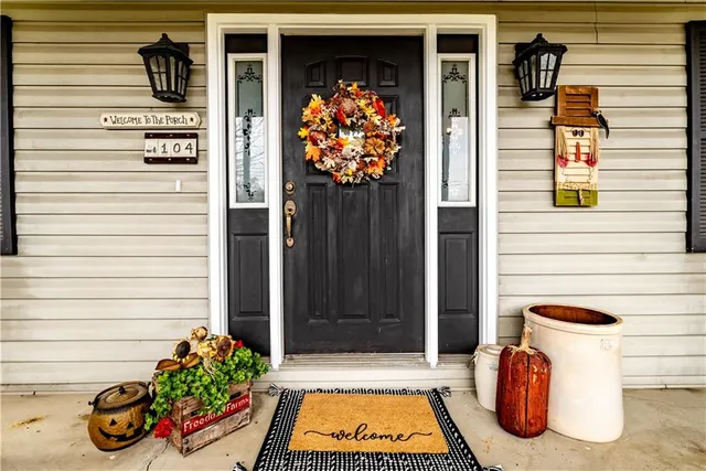 a view of front door of house and a outdoor space