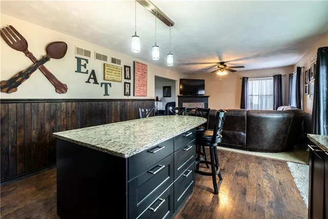 a kitchen with a table and chairs