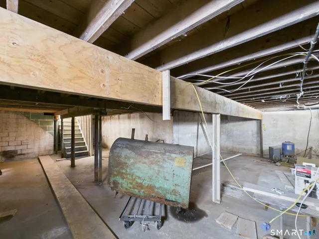 a front view of house with yard covered in snow