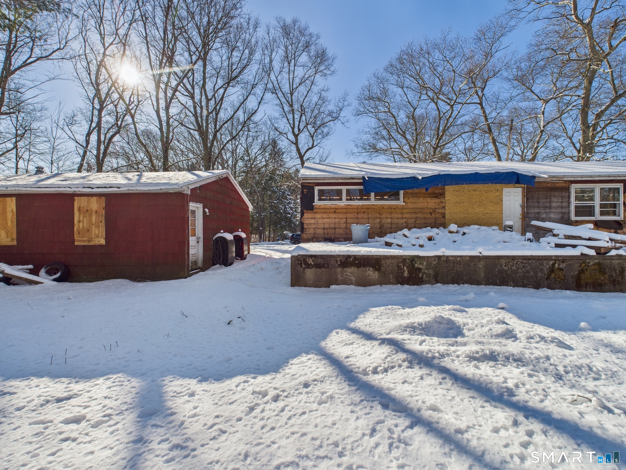 60 Highland Road Mansfield Center, CT 06250 - Photo 17 of 21 a view of a house with a snow in the yard