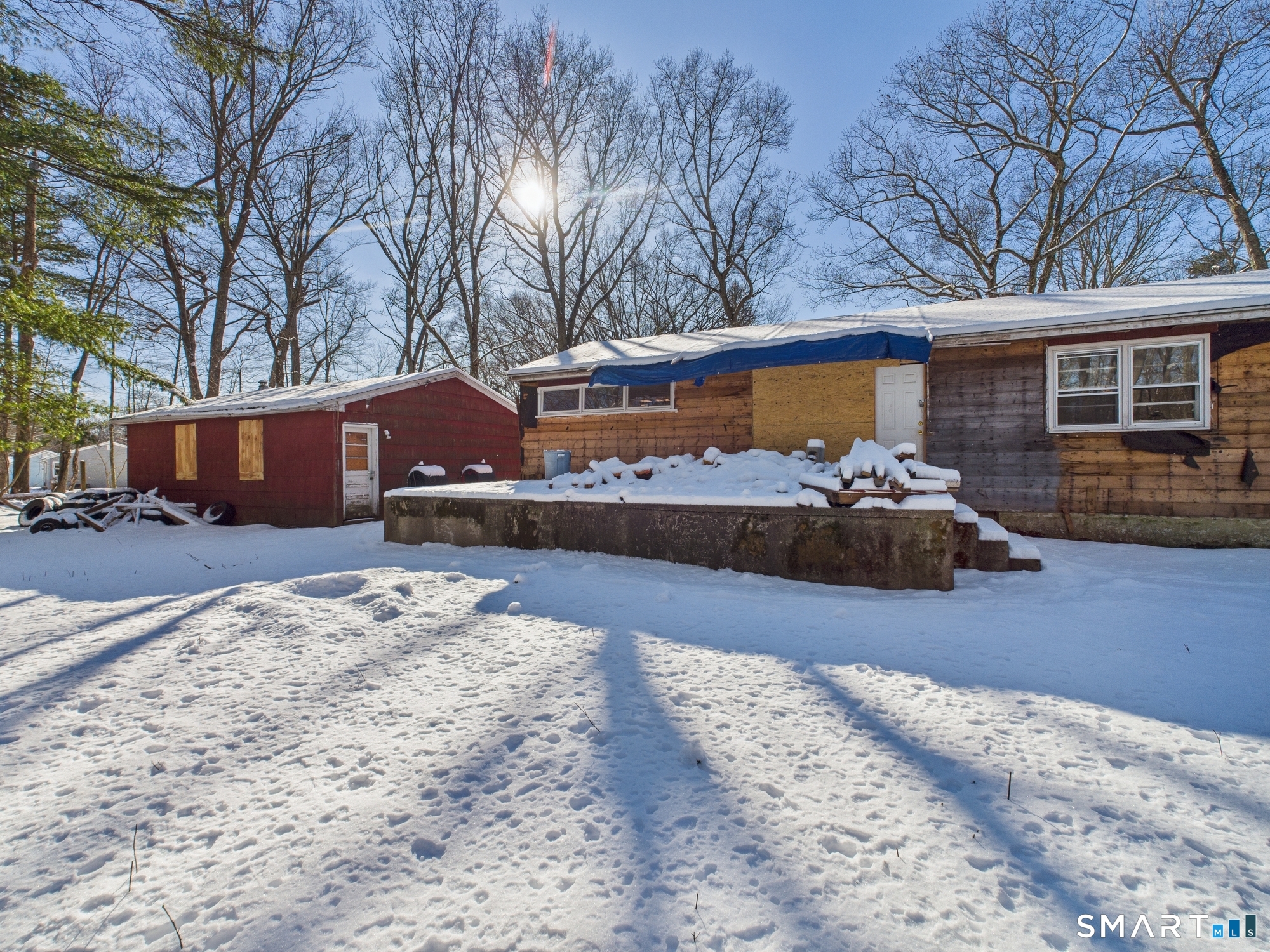 60 Highland Road Mansfield Center, CT 06250 - Photo 18 of 21 a front view of house with yard covered in snow