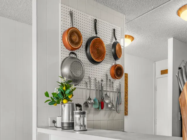 a vase of flowers sitting on a floor