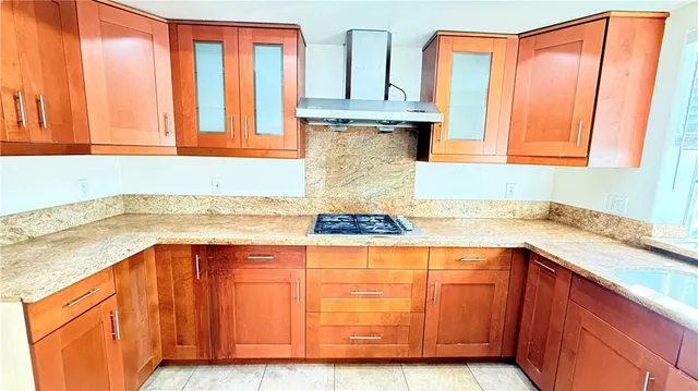 a kitchen with stainless steel appliances granite countertop a sink and dishwasher