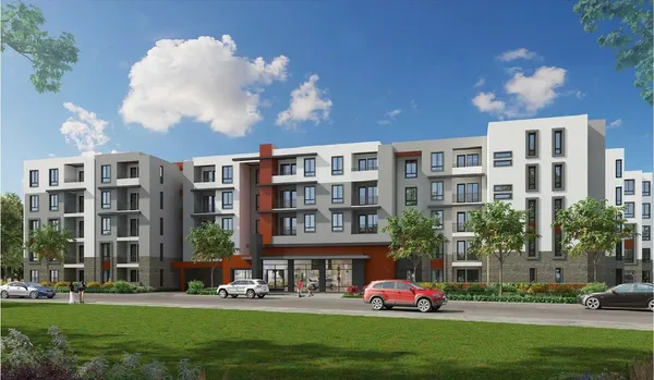 a tall building with a yard in front of it