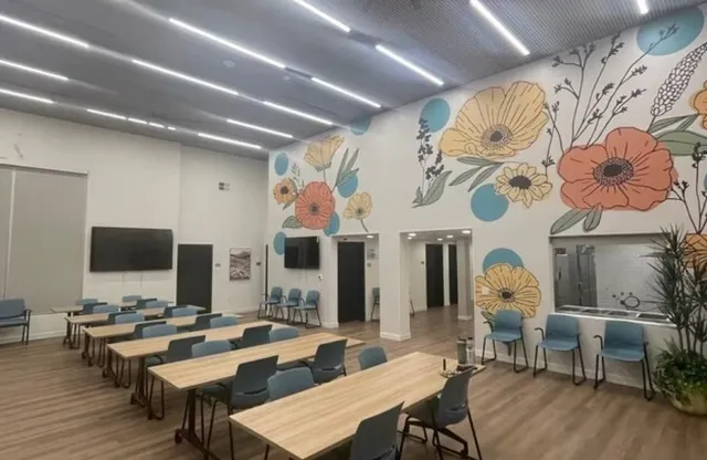 a living room with fireplace furniture and a flat screen tv