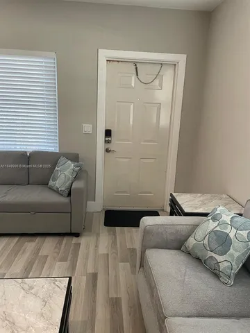 a living room with furniture and a couch