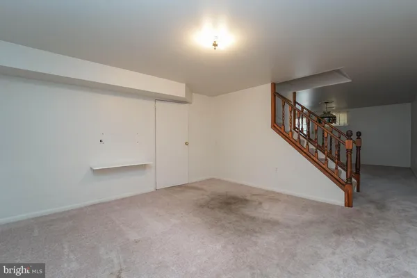 a view of an empty room with stairs