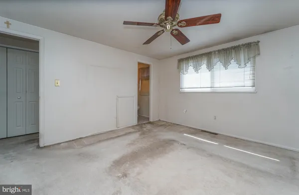 a view of an empty room with a window