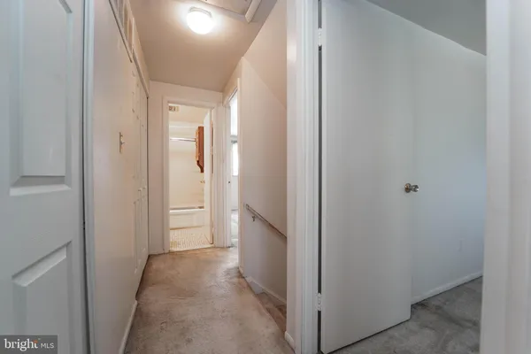 a view of a hallway with an empty room
