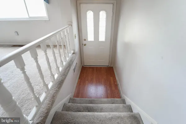 a view of entryway with wooden floor
