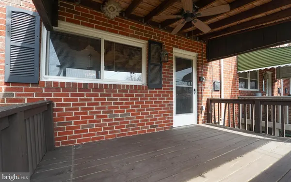 a view of a brick house with wooden door