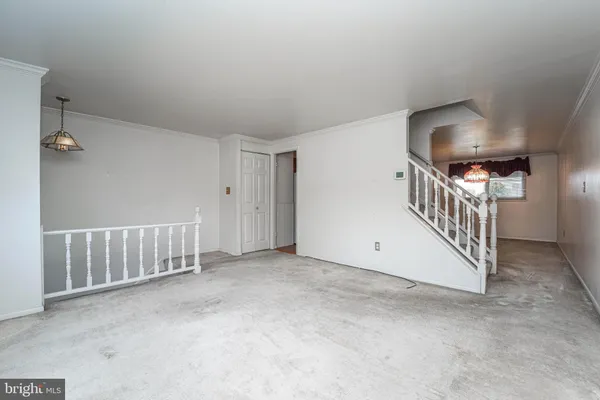 a view of a hallway with staircase