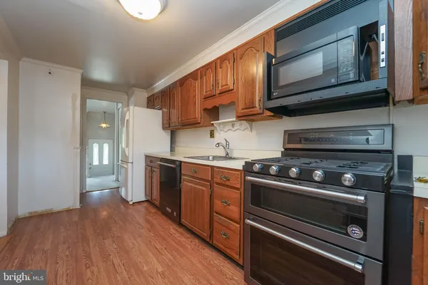 a kitchen with a stove oven and cabinets