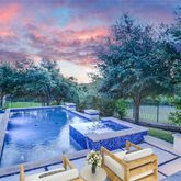 a view of a chairs and table in the patio
