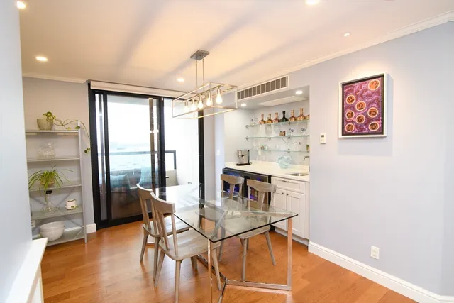 a view of a livingroom with furniture window and wooden floor