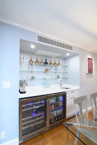 a stove top oven sitting inside of a kitchen