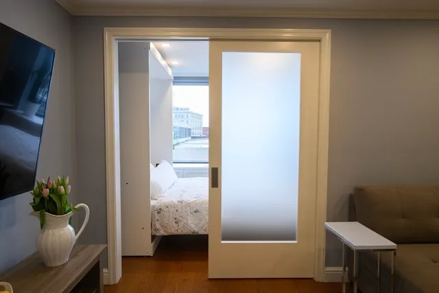 a view of hallway with livingroom and furniture