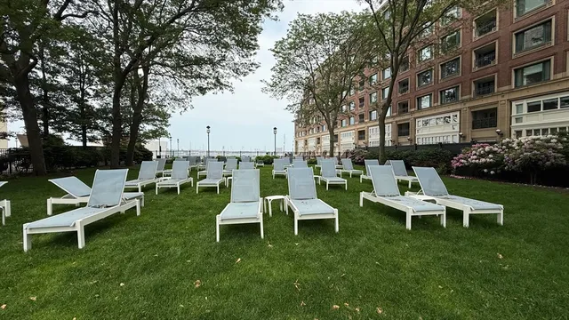 a view of a lake with boats and trees