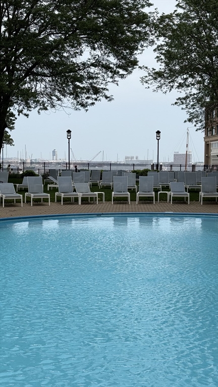 65 East India Row, Unit 9C Boston, MA 02110 - Photo 38 of 40 a view of a lake with boats and trees