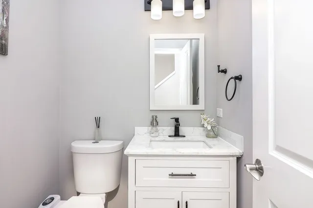 a bedroom with a bed and a bookshelf