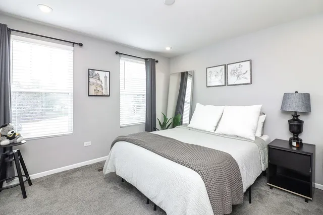a bathroom with a sink toilet and mirror