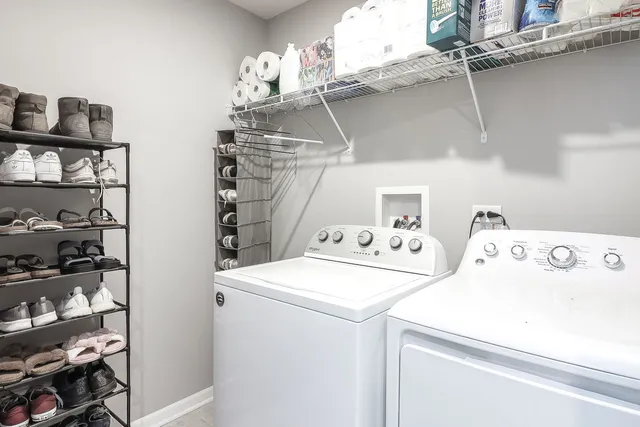 a bedroom with a bed tv and furniture