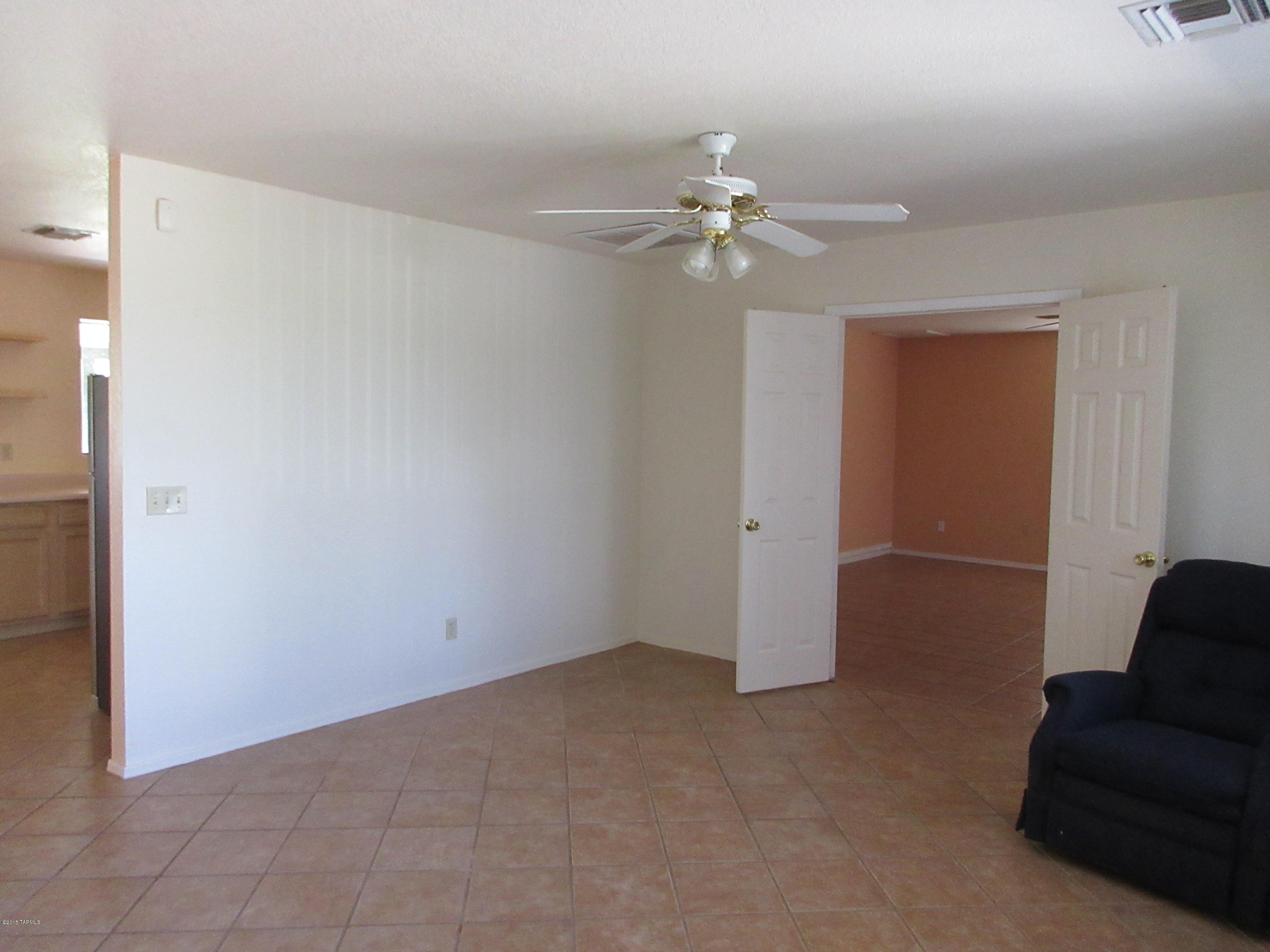 876 Calle Zapotec Rio Rico, AZ 85648 - Photo 20 of 29 an empty room with windows and fan