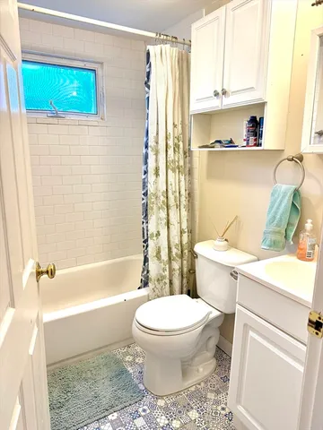 a bathroom with a sink a toilet and a bathtub