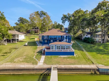 a view of a lake with houses swimming pool and outdoor space