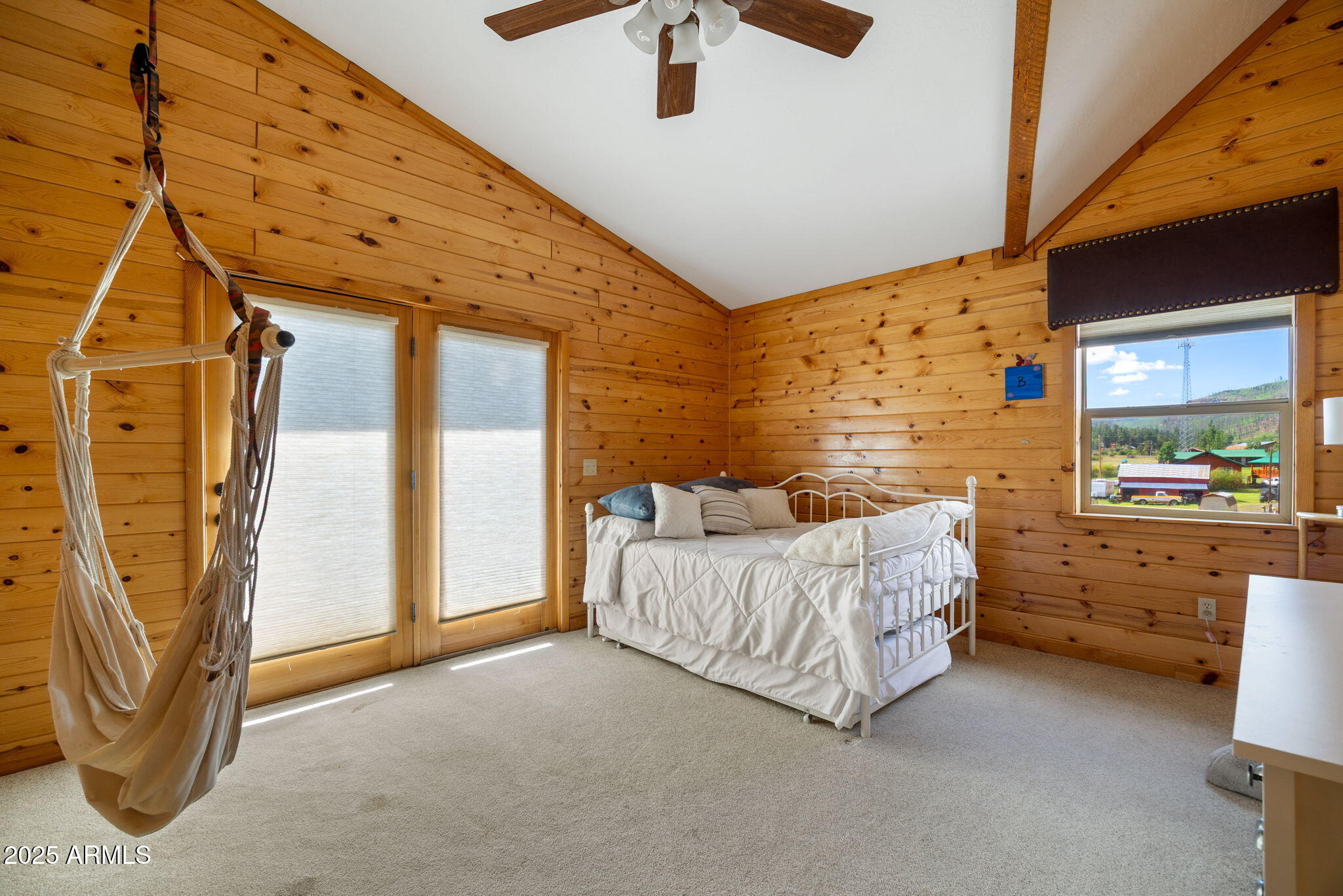100 Main Street Greer, AZ 85927 - Photo 28 of 63 a bed room with a bed and a window