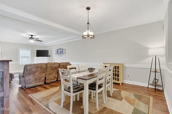 a kitchen with granite countertop white cabinets white stainless steel appliances with a sink and dishwasher