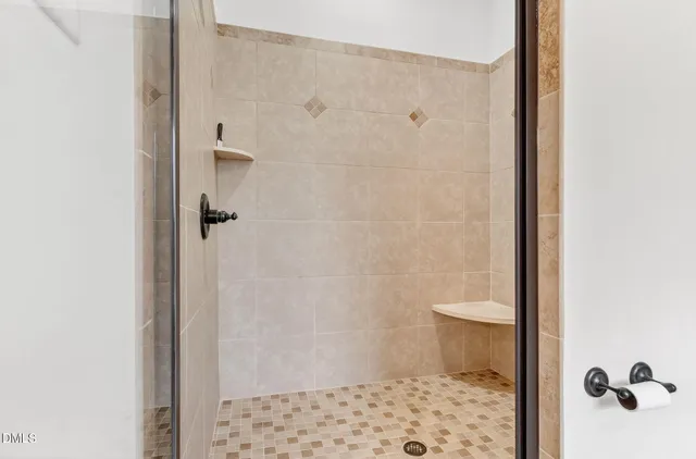 a bathroom with a shower and a toilet