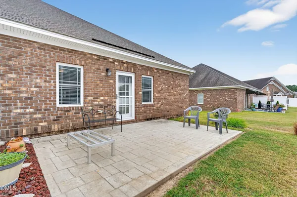 a front view of house with yard outdoor seating and green space