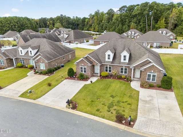 an aerial view of a house with a garden