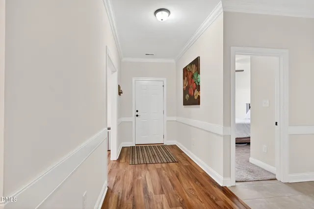 a view of a hallway view with wooden floor and staircase