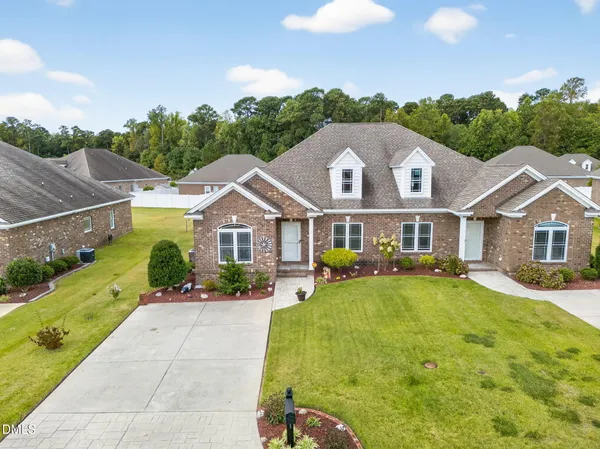 a view of a house with a yard
