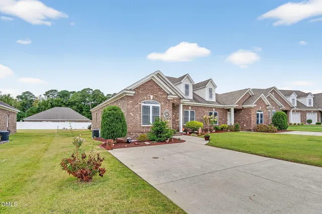 a front view of a house with a yard