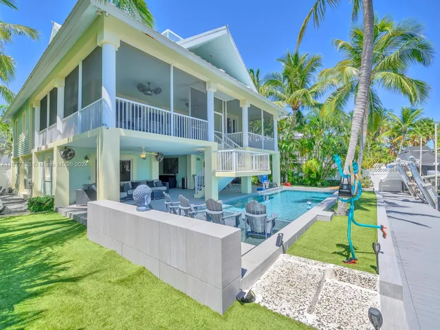 a view of a wooden deck and lake view