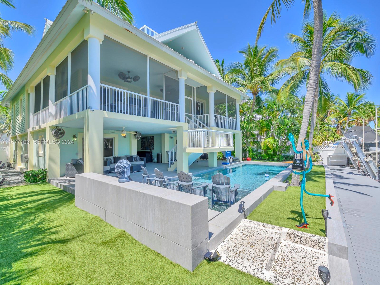 3 North Drive Key Largo, FL 33037 - Photo 13 of 54 a view of a house with swimming pool and sitting area