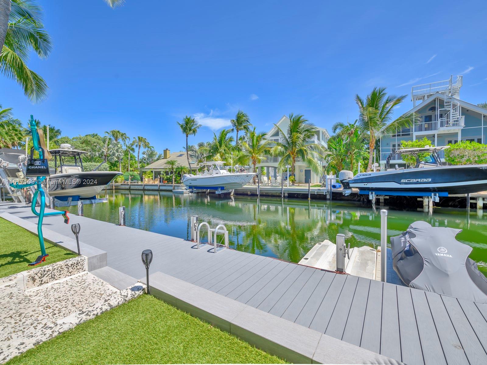 3 North Drive Key Largo, FL 33037 - Photo 14 of 54 a view of a wooden deck and lake view