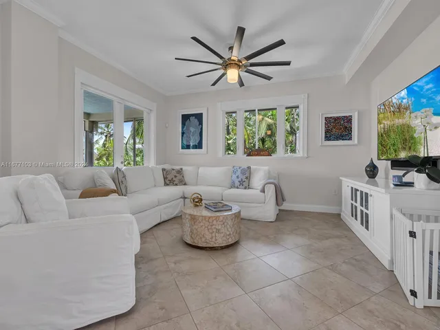 a dining room with furniture a window and kitchen view