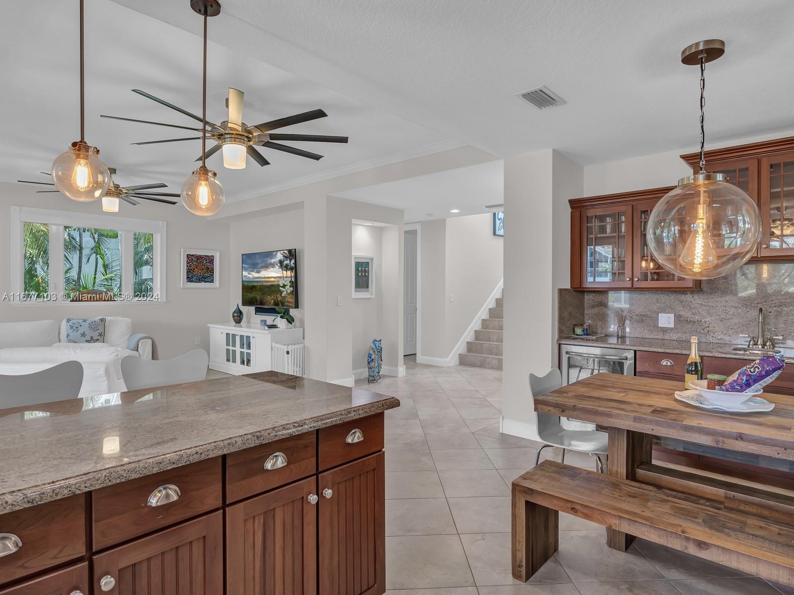 3 North Drive Key Largo, FL 33037 - Photo 21 of 54 a kitchen with a table chairs and chandelier
