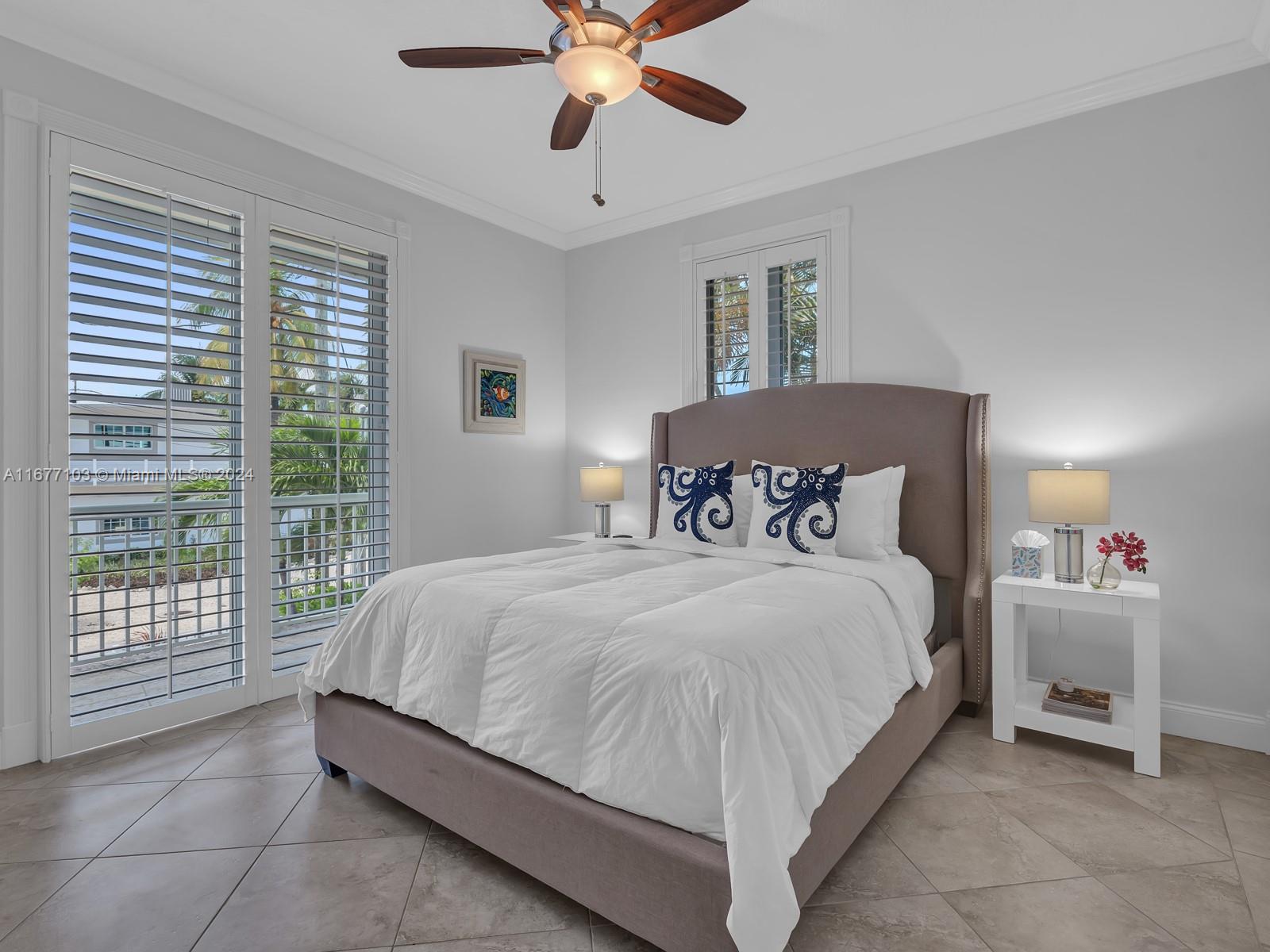 3 North Drive Key Largo, FL 33037 - Photo 26 of 54 a bedroom with a bed and window