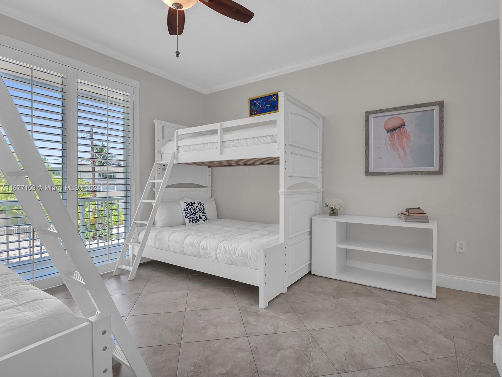 3 North Drive Key Largo, FL 33037 - Photo 31 of 54 a bedroom with a bed and a view of ceiling fan