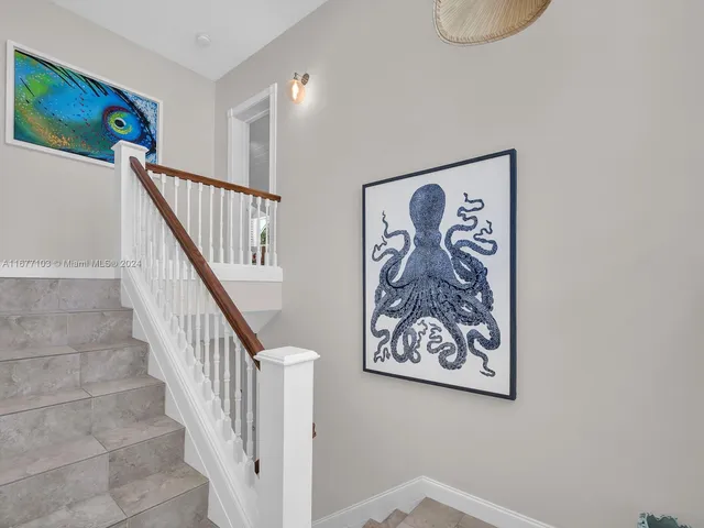 a bedroom with a large bed and a large window