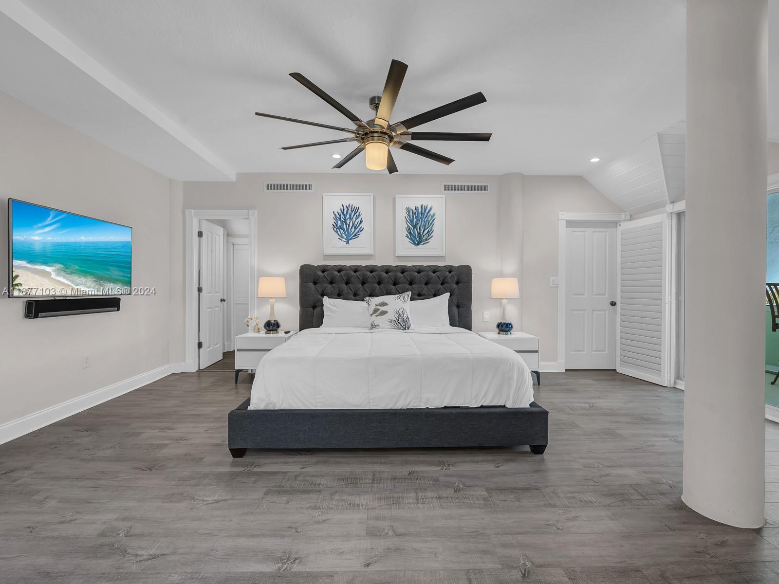 3 North Drive Key Largo, FL 33037 - Photo 37 of 54 a bedroom with a bed and a ceiling fan